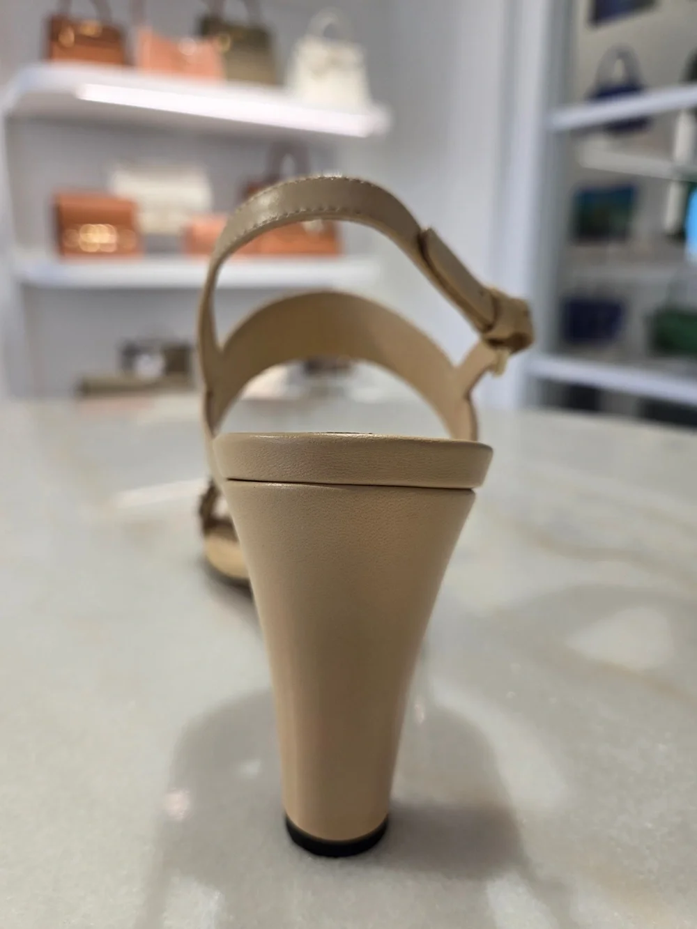 CHANEL Beige Slingback Heels with Black-and-Gold Chain
